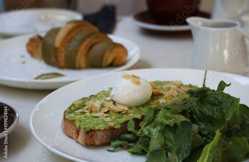 Avocado toast and croissant for breakfast