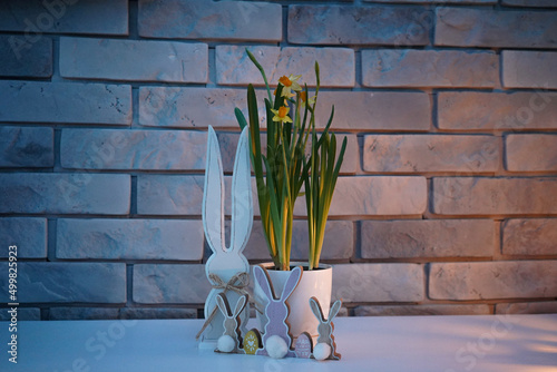 Easter bunny rabbit with flowers in a vase