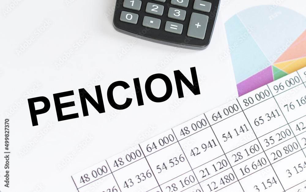 PENCION text on notepad next to calculator, reports, business concept PENCION text on notepad next to calculator, reports, business concept