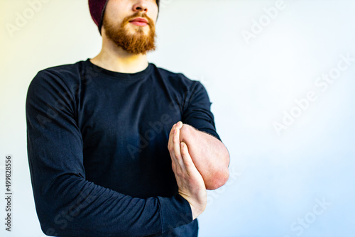 close up amputee hands of young man indoors doing warm up in gym