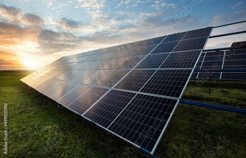 Solar panels on sky background. Solar power plant. Green electricity. photo