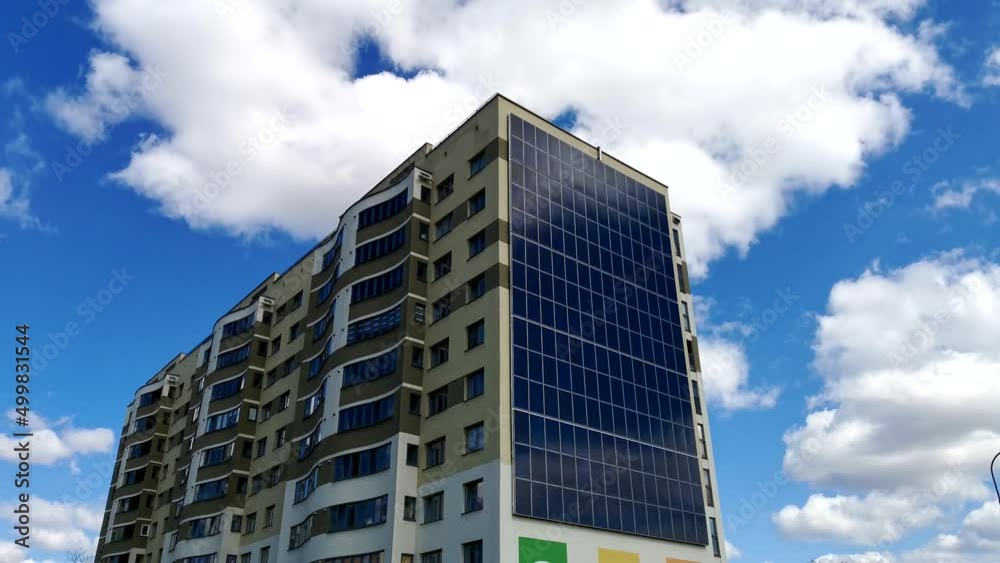 Solar panels installed on the outer wall of residential building. An energy-efficient house in which part of the energy is obtained from solar panels. Solar panels installed on the outer wall of residential building. An energy-efficient house in which part of the energy is obtained from solar panels.