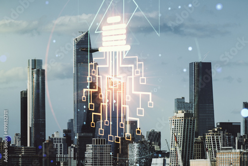 Double exposure of virtual creative light bulb hologram with chip on New York city skyscrapers background, idea and brainstorming concept