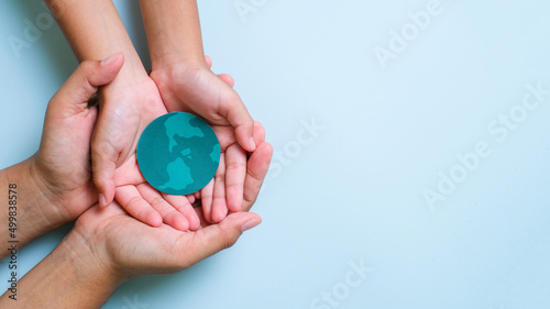 Hands holding earth globe, world environment day, world earth day, world ocean day.