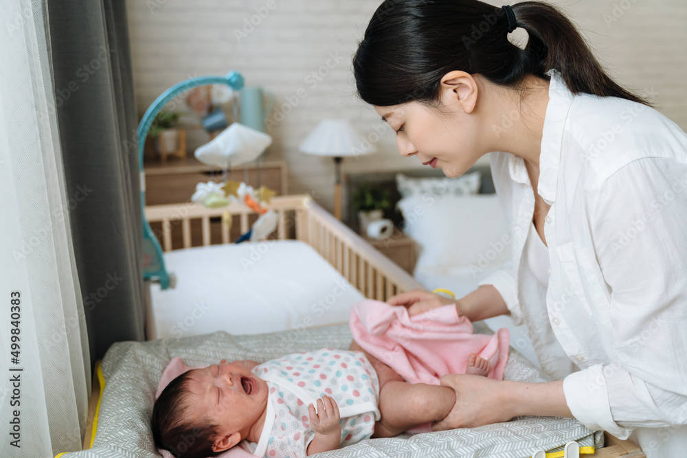 korean infant burst into tears out of diaper rash while her mom is