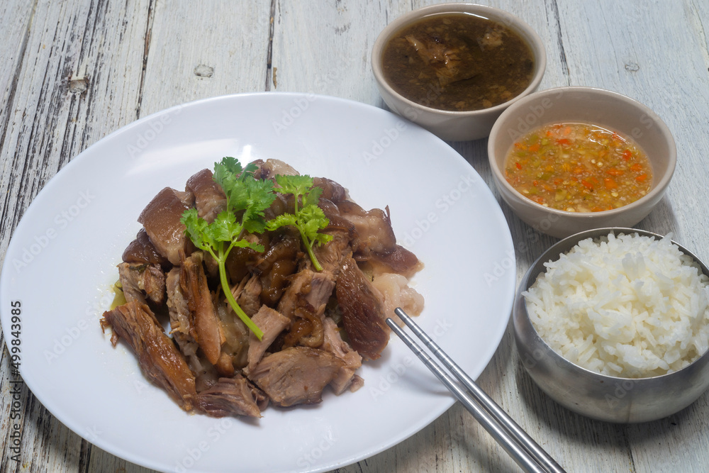 Boiled pork knuckle with chinese herbs. served with Thai style pickled chillies in vinegar. Boiled pork knuckle with chinese herbs. served with Thai style pickled chillies in vinegar.