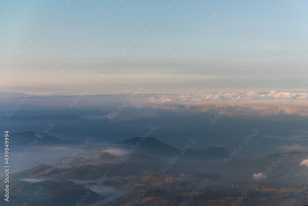 Landscape seen from a plane of mountains between mists in a Colombian mountain range.
