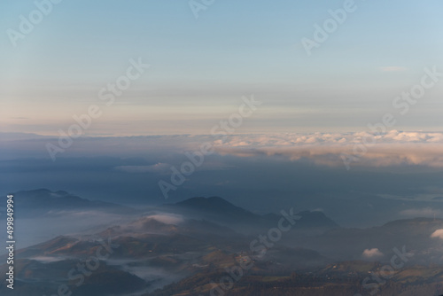 Landscape seen from a plane of mountains between mists in a Colombian mountain range. © EGT