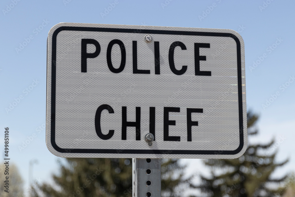 Police Chief sign in a parking lot. The police chief needs a parking spot close to the station and often reserves a space.