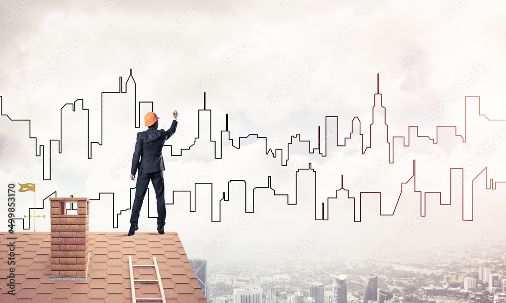 Man architect draw silhouette of modern city on blue sky. Mixed Man architect draw silhouette of modern city on blue sky. Mixed