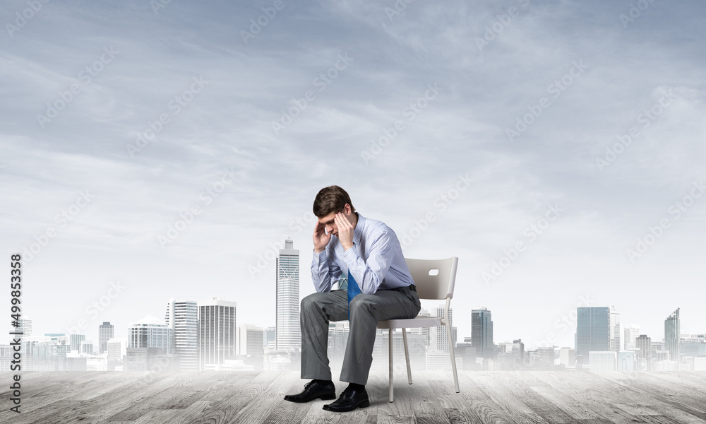 Businessman sitting on an office chair Businessman sitting on an office chair