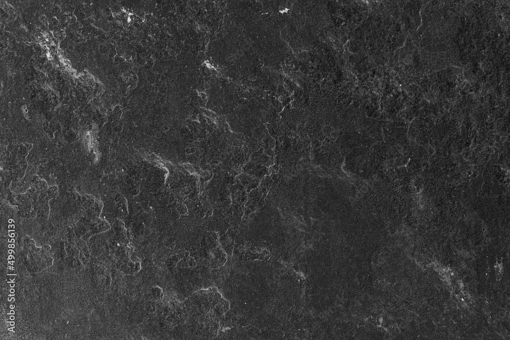 Abstract textured dark stone wall surface for background