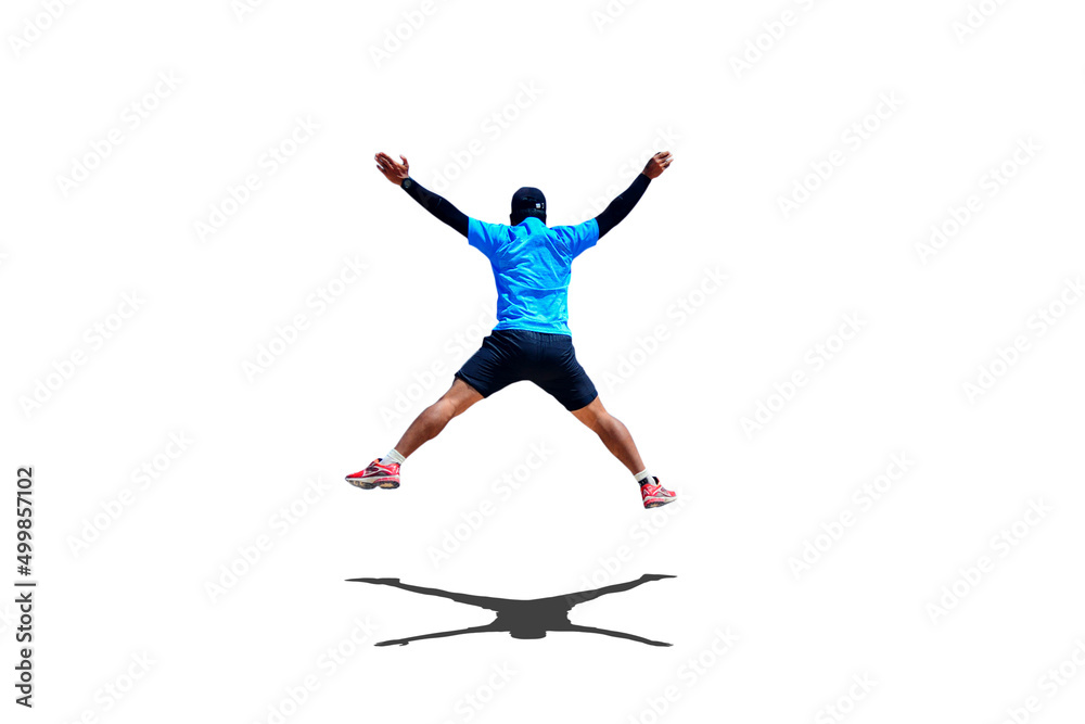 Man jumping with arms and legs spreading joyfully on colored background with clipping path