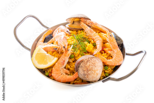 paella in a dish isolated on a white background