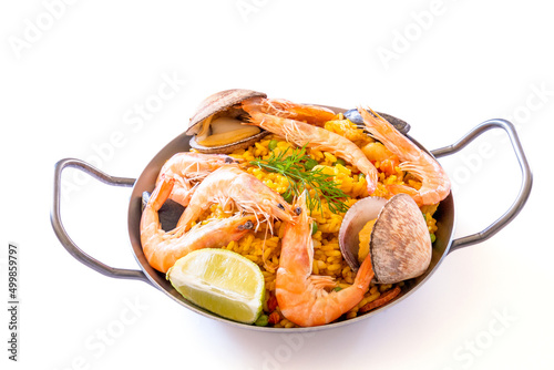 paella in a dish isolated on a white background