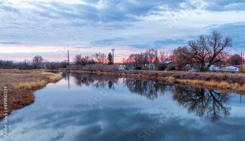 Beautiful sunrise over the Rio Grande in Alamosa, Colorado photo