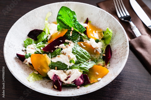 Healthy salad with persimmon