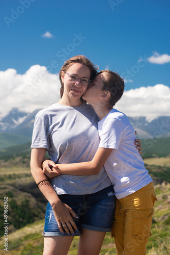 A child embraces mom in the...