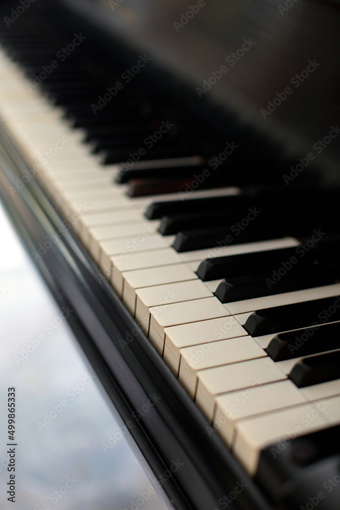 closeup of the keyboard of an old piano closeup of the keyboard of an old piano
