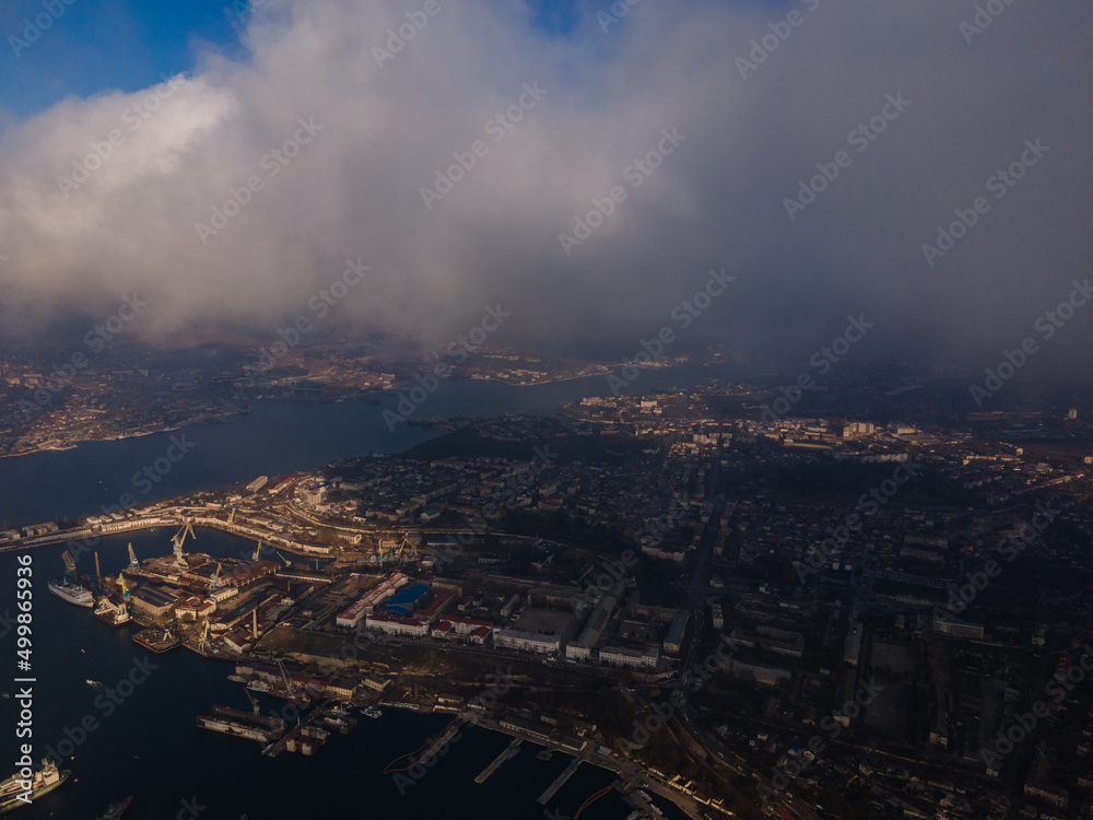 A magical flight in the clouds over the city. The sun's rays are beautifully reflected from the clouds. Above the sky. Fluffy clouds. shooting at high altitude. A magical flight in the clouds over the city. The sun's rays are beautifully reflected from the clouds. Above the sky. Fluffy clouds. shooting at high altitude.