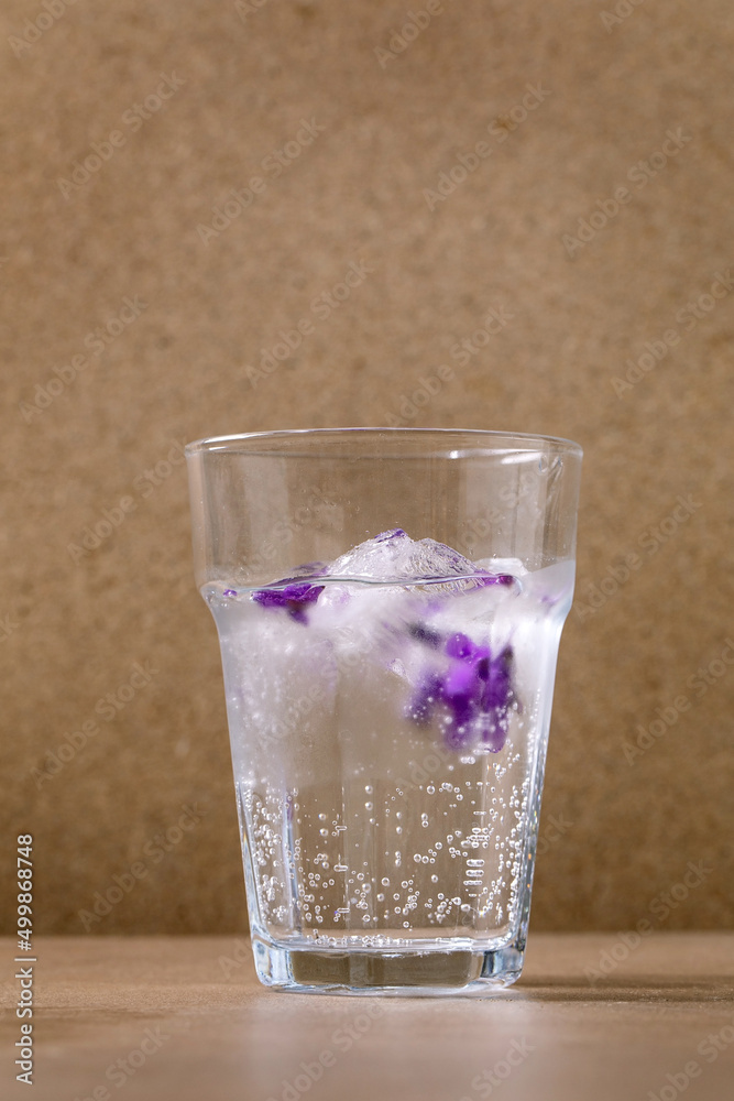 glass of soda with of violets flower glass of soda with of violets flower