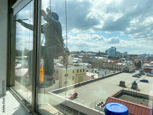 window cleaner with sponge cleaning glass window, Cleaning conept image photo