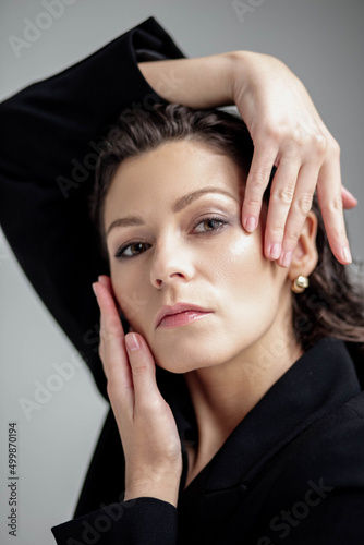 portrait of a beautiful brunette woman, model look into the camera. concept of fashion and beauty business woman.