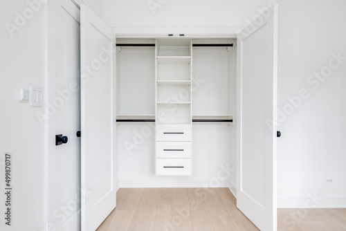 Custom Closet Organization. Contemporary closet design with shelves, drawers and rods.