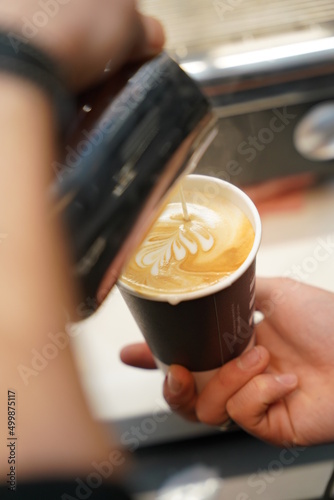 Barista making coffee art