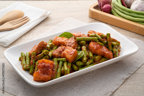 Stir fried pork and yardlong bean with red curry paste photo