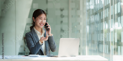 Modern Asian Business woman have confident working with financial team by video conference at office. Accounting concept.