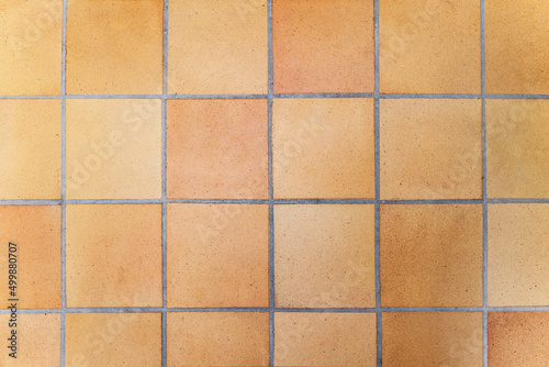Tile brown yellow old floor with cement  background texture