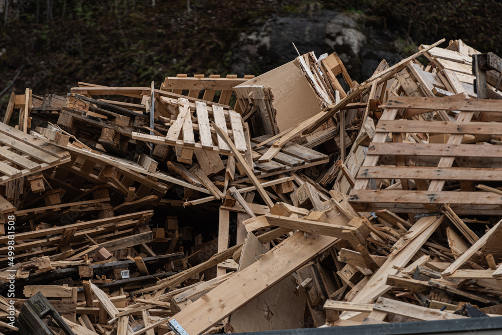 Destroyed wooden pallets at a landfill.