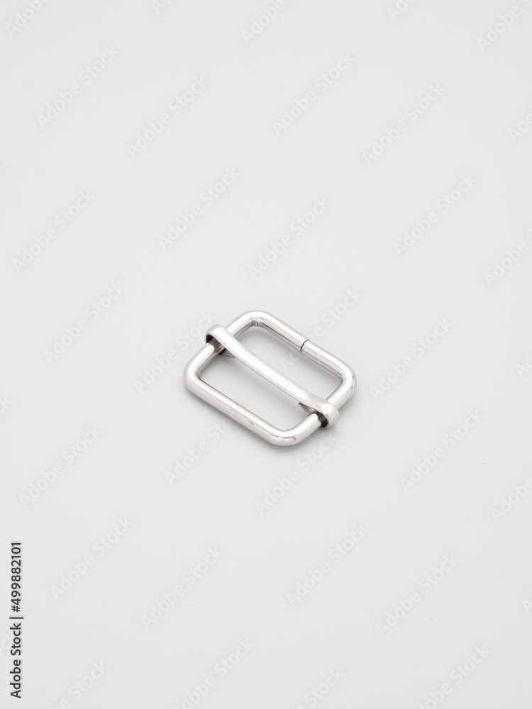 Metal adjusters and frames for making bags and backpacks on a grey background. Chrome-plated metal frames for handbags straps. Sewing accessories, bags making Metal adjusters and frames for making bags and backpacks on a grey background. Chrome-plated metal frames for handbags straps. Sewing accessories, bags making