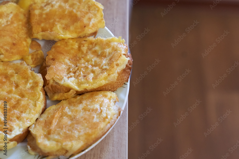 Delicious egg sandwiches on a wooden table. A hot homemade sandwich with space to copy. Delicious egg sandwiches on a wooden table. A hot homemade sandwich with space to copy.