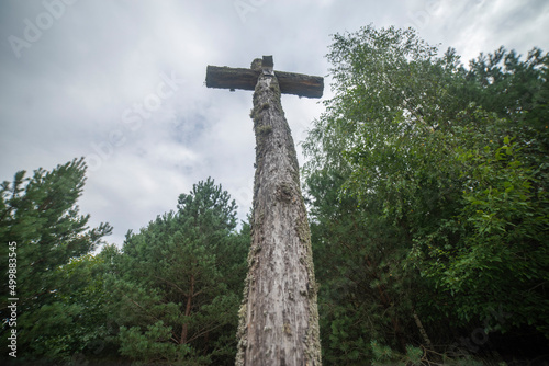 old wooden cross in the forest