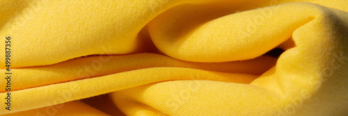 Bright, yellow, fluffy, light blanket. Texture textile background