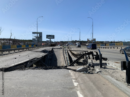 Irpin, Ukraine - April 01, 2022: War in Ukraine. Chaos and devastation on the outskirts of Irpin. Blown up bridge as a result of rocket fire and shelling of a peaceful city