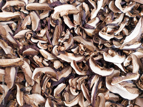 Background of dried mushrooms. Mushrooms are laid out in a thin layer. High quality photo