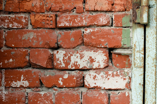 Texture of a red brick wall with streaks of white paint, texture of bricks