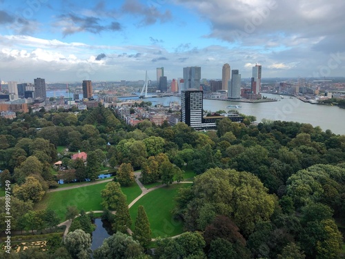 Aerial view of the city of Rotterdam in autumn, its city center and its skyscrapers, the Het Park, on a slightly cloudy day