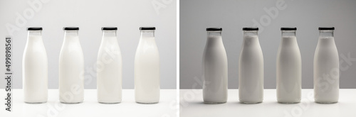 Packaging for dairy products, glass bottles for milk on a white background. Unmarked bottles filled with milk. Bottles under different lighting.