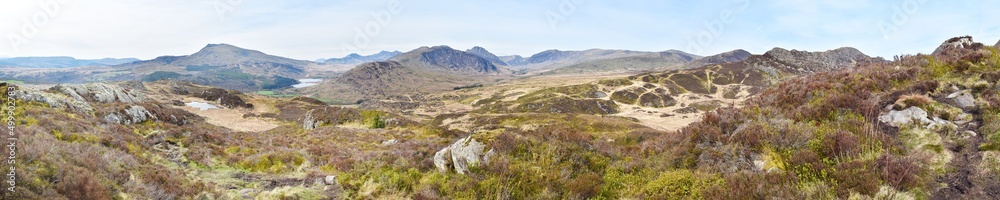 Large panorama of the countryside in Snowdonia, Wales, UK. The background includes Mt Snowdon, Y Lliwedd, Crib y Ddysgl, Crib Goch and Glyder Fawr, with the lakes of Llynnau Mymbyr and Llyn y Coryn.