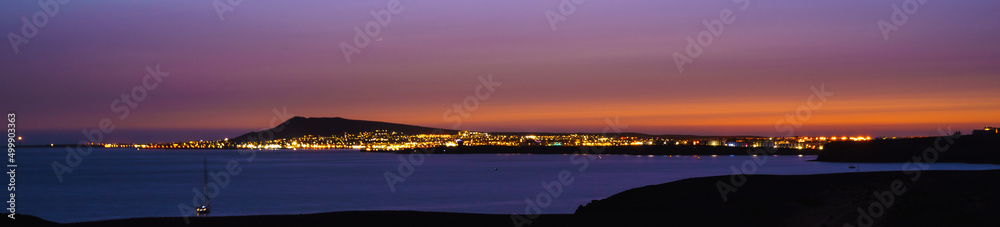 Panoramic view of the island of Fuerteventura from Papagayo beach (Lanzarote, Spain) at sunset Panoramic view of the island of Fuerteventura from Papagayo beach (Lanzarote, Spain) at sunset