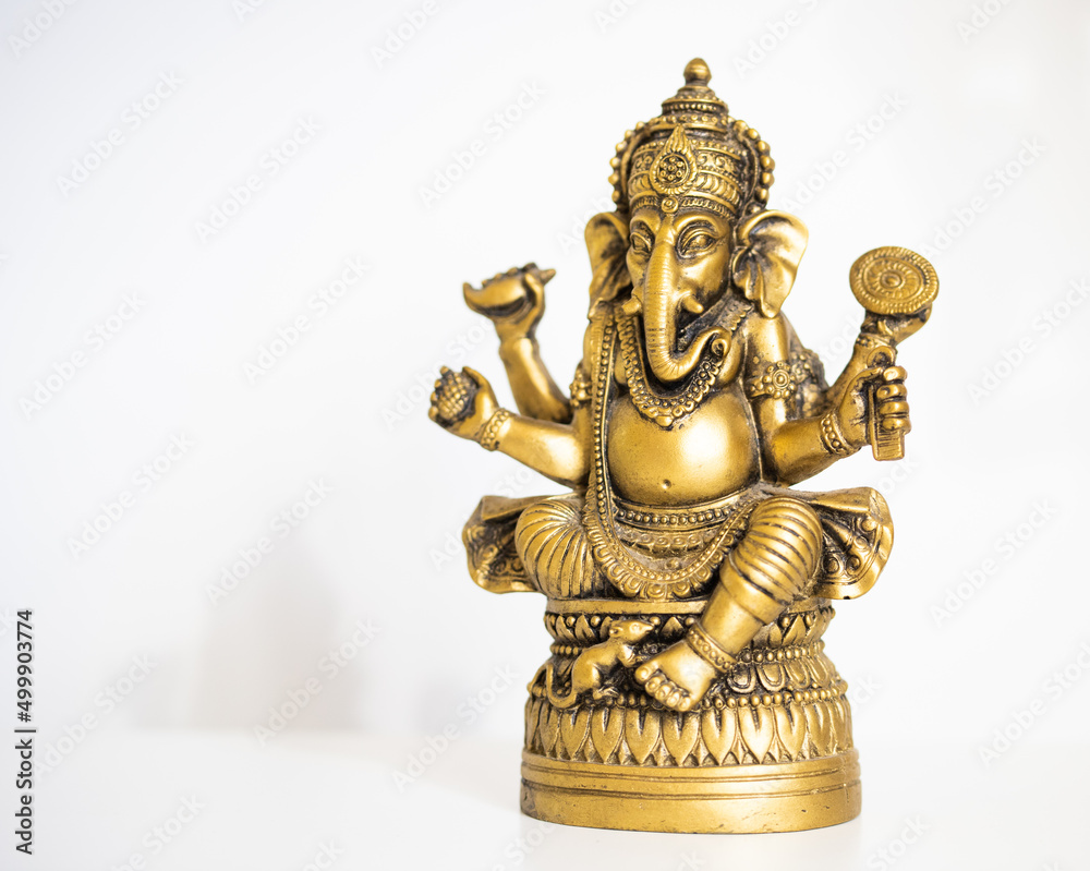 golden Ganesha statue spirituality background