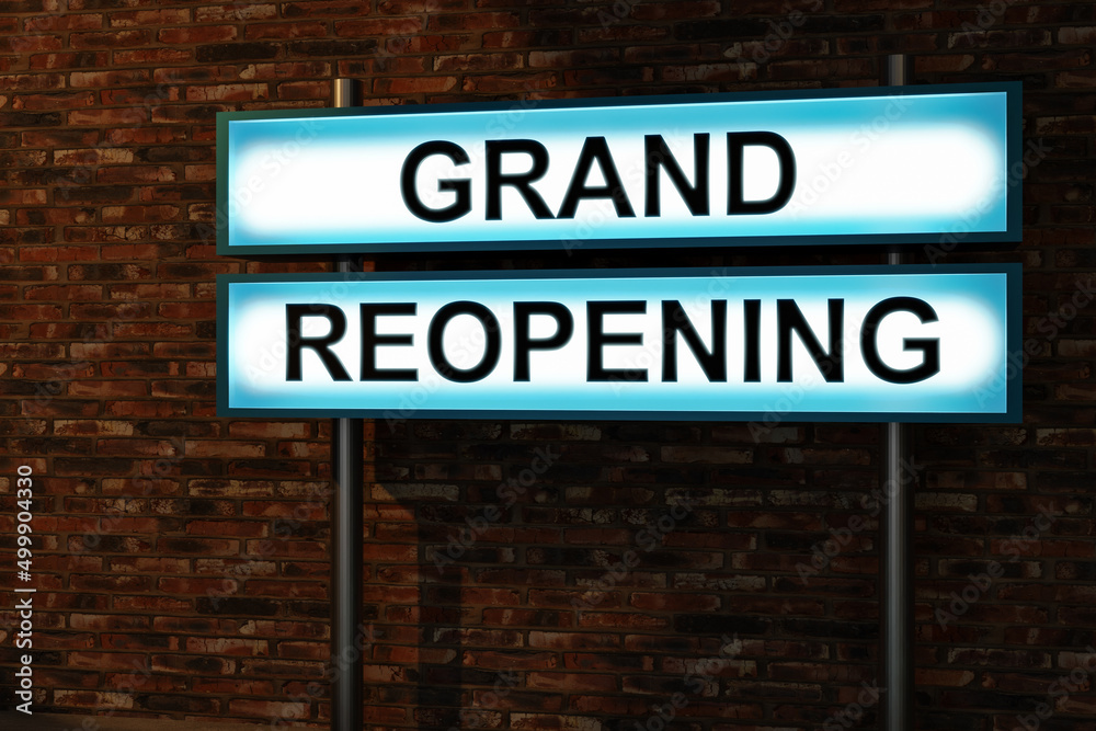 Grand reopening. Black letters on a light box. The illuminated sign placed in front of a brick wall. Opening, new start and new business concept. 3D illustration Grand reopening. Black letters on a light box. The illuminated sign placed in front of a brick wall. Opening, new start and new business concept. 3D illustration