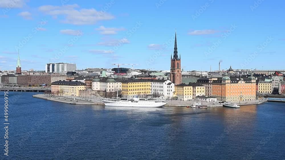 Stockholm, Sweden - April 19, 2022: Overlooking the of famous Stockholm skyline including Stockholm city center and the historic Riddarholmen in Gamla Stan old town district. Stockholm, Sweden - April 19, 2022: Overlooking the of famous Stockholm skyline including Stockholm city center and the historic Riddarholmen in Gamla Stan old town district.