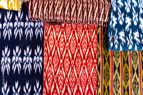 Scarves or Macanas at the market, traditional handcraft and design for Gualaceo canton, Azuay province, made by using technique called Ikat. Colorful fabrics background. Cuenca, Ecuador photo