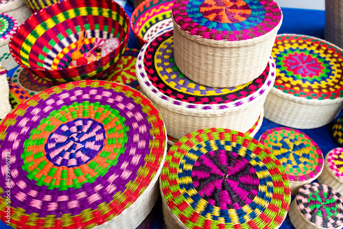 Wicker souvenirs baskets made from toquilla straw  vegetable fiber and painted with various colors at the artisan market in Cuenca  Ecuador