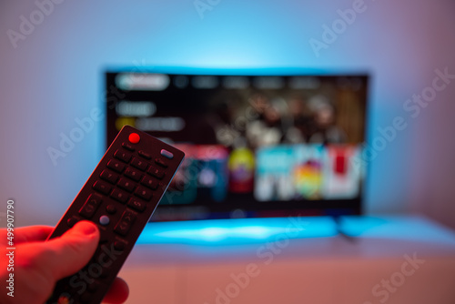 Remote control on the background of the TV